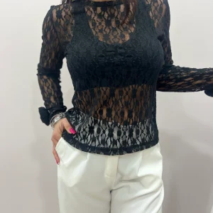 Maglia donna in pizzo elegante elasticizzata